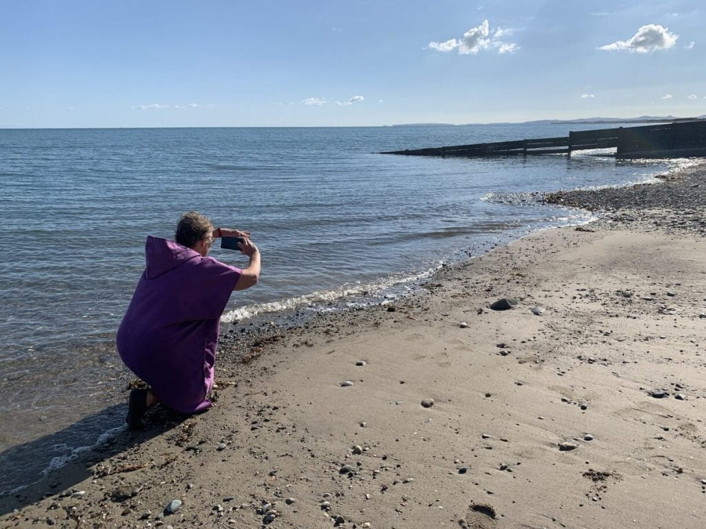 One of the CTC participants filming on a beach